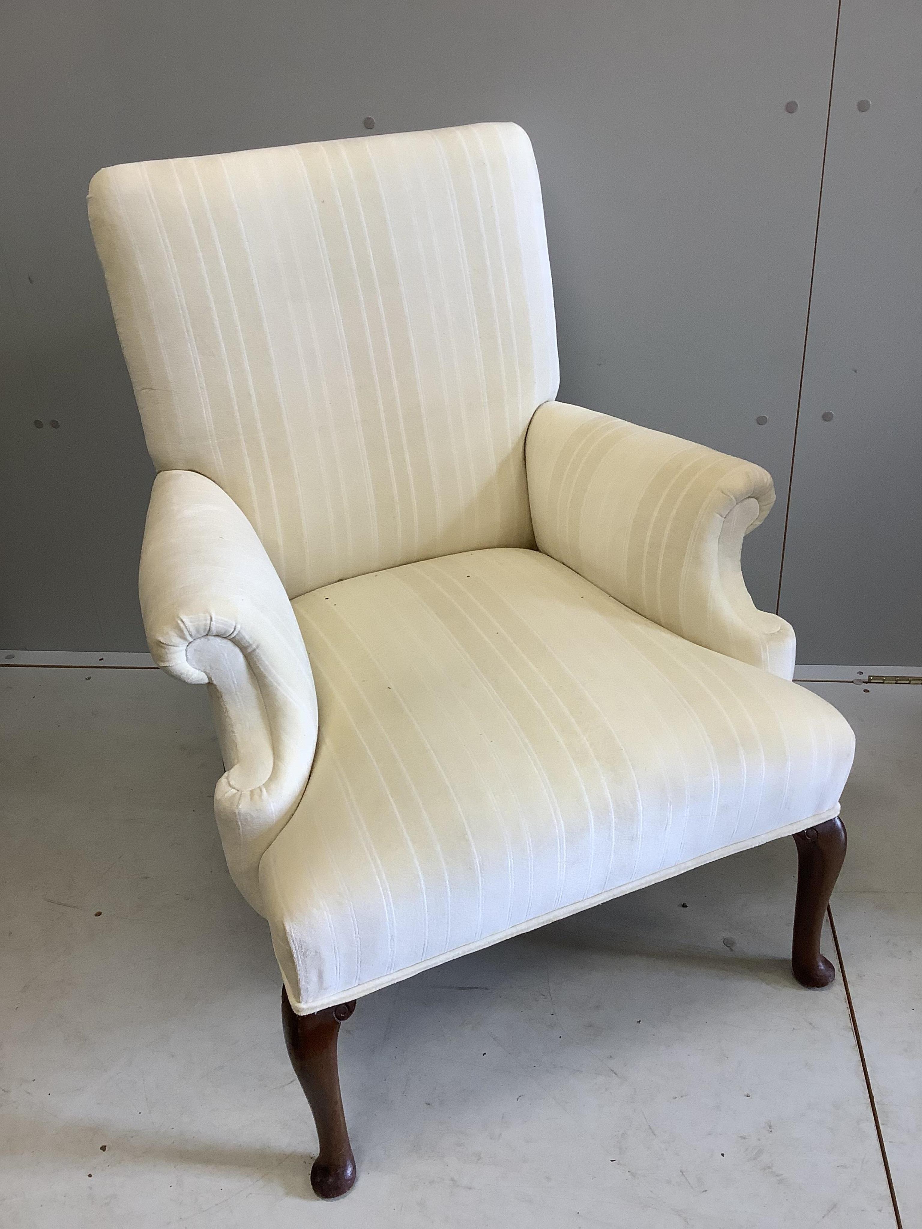 A Victorian style scroll armchair, recently re upholstered, width 69cm, depth 64cm, height 88cm